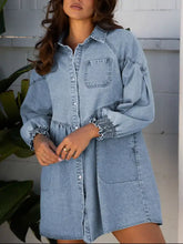 Light blue denim shirt dress with smocked cuffs elasticated cuffs and front button closure in denim fabric