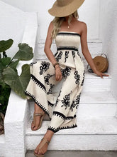 Smocked printed wide leg jumpsuit in beige black floral pattern