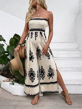 Smocked printed wide leg jumpsuit with beige strapless maxi design and black floral embroidery