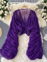 Vibrant purple smocked ruched chiffon crop top with deep v-neckline and voluminous long sleeves