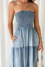 Strapless denim dress with smocked tube slit bodice and tiered skirt in blue denim fabric for casual wear