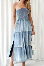 Denim blue strapless smocked tube slit tiered maxi dress with ruffled layers and a smocked bodice