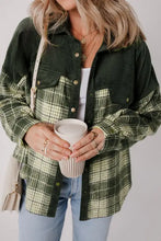 Green plaid shacket oversized flannel jacket with long sleeve length, laid flat