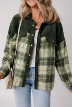 Oversized olive green plaid shacket with long sleeve length, laid flat