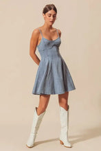 So me a line fit and flare light-wash denim mini dress with thin straps and a flared skirt perfect for casual wear