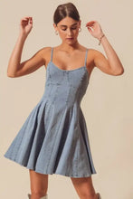 A light-wash denim mini dress with thin straps and a flared skirt in the so me a line fit and flare style