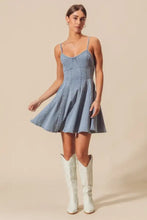 A light-wash denim mini dress with thin spaghetti straps and a flared skirt from so me a line fit and flare denim mini dress collection