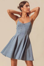 A light blue denim mini dress with thin straps and a flared skirt from so me a line fit and flare collection