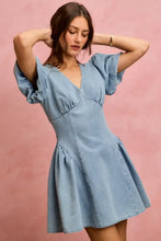 A light blue denim fit and flare mini dress featuring bubble sleeves denim and a flared skirt by so me