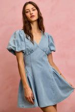 A light blue denim fit and flare mini dress with bubble sleeves and a flared skirt from SO ME collection