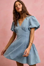 A light blue bubble sleeves denim fit and flare mini dress with puffed short sleeves and a flared skirt