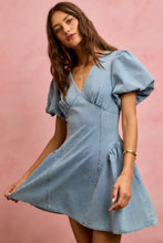 A light blue denim mini dress with bubble sleeves and a v-neckline from the so me fit and flare collection