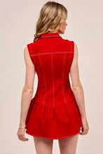 A vibrant red sleeveless collared game day mini dress with white stitching details and button down front