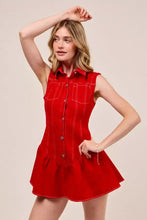 Red sleeveless denim mini dress with button front and stitched pockets ideal for collared game day events