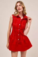 A vibrant red sleeveless collared game day mini dress in denim with button front and white stitching details