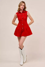 A vibrant red sleeveless collared game day mini dress in denim with button front and flared skirt design