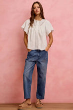 White eyelet cotton gauze blouse with lace trim gathered neckline and short flutter sleeves for a light feminine look
