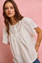 White cotton gauze blouse with lace trim around the neckline and short flutter sleeves from SO ME collection