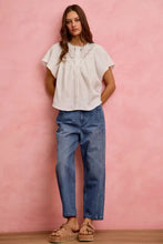 White cotton gauze blouse with lace trim flutter sleeves button front and ruffled neckline for elegant wear