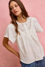 White cotton gauze blouse with lace trim and delicate flutter sleeves from so me collection