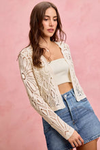 Cream-colored crochet knit long sleeves cardigan sweater with floral pattern