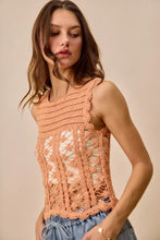 A peach-colored crochet knitted lace sleeveless top with an open front design from SO ME lace sweater tank collection