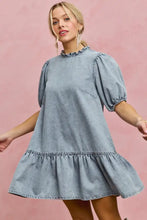 Light wash denim dress with puffed sleeves and ruffled hem in a short sleeves mini tiered style