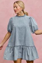 Light wash denim dress with puffed sleeves and ruffled hem in a SO ME denim short sleeves mini tiered dress style