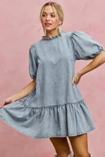 Light wash denim dress featuring puffed sleeves and a tiered hem in the SO ME Denim Short Sleeves Mini Tiered Dress