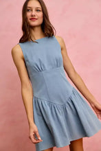 So me fit and flare sleeveless light blue denim mini dress with a fitted bodice and flared skirt