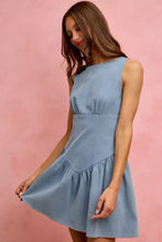 A light blue denim mini dress with a sleeveless fitted bodice and flared skirt in the SO ME Fit And Flare style
