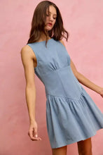 A light blue denim mini dress with a sleeveless fitted bodice and flared skirt from SO ME fit and flare collection