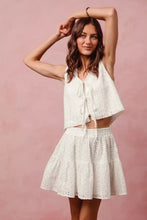 White eyelet lace tie front vest top and tiered mini skirt set