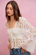White floral pattern crochet cardigan with lace patterns and bell sleeves