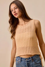 Beige low gauge pointelle sleeveless sweater tank top with ribbed knit, round neckline, and tie-side details