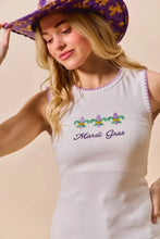 White sleeveless ribbed tank top with purple embroidered mardi gras text and colorful fleur-de-lis with contrast blanket stitch