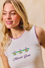 White sleeveless mardi gras tank top with purple and green fleur-de-lis embroidery and contrast blanket stitch trim