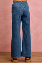 Back view of blue stretch denim wide-leg mid rise stretch denim jeans with classic back pocket design
