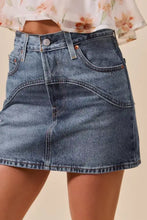 So me washed denim mini skirt with mid-waisted fit, classic five-pocket design, subtle fading, and copper-toned hardware