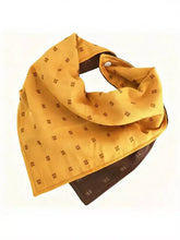 Soft pet scarf in mustard-yellow with brown geometric pattern