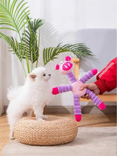 Pink and purple crocheted plush animal pig toy with long segmented limbs