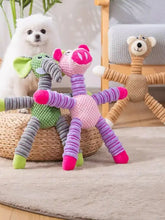 Pink purple plush animal pig dog toy with green elephant bear nearby