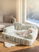 Cozy plush pet bed with soft mint and gray striped pattern