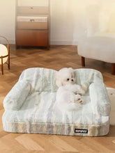 Soft plush pet bed in light blue and white striped armchair design