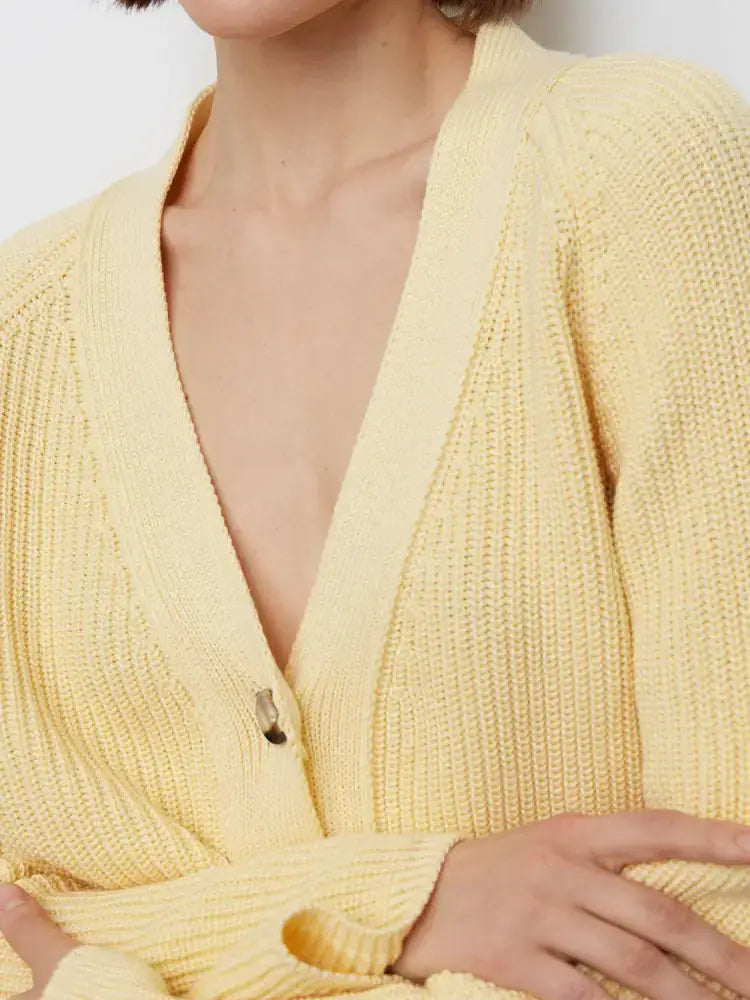 Soft yellow ribbed knit cardigan for effortless elegance in casual outerwear