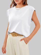 White sleeveless solid color round neck tank with relaxed fit and soft flowing fabric for casual wear