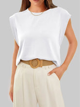 White solid color round neck tank with sleeveless relaxed fit and soft fabric for comfortable wear