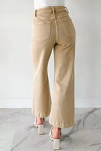 Beige solid color seamed wide-leg denim trousers with high waist and rolled cuffs in a cropped design