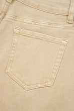 Beige denim solid color seamed center wide leg cropped jeans pocket with matching stitching and faded texture visible
