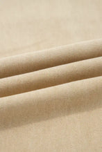 Beige cotton fabric with subtle woven texture on solid color seamed center wide leg cropped jeans